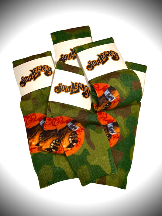 SOUL DAP CAMO STREETWEAR UNDER CALF SOCKS Mid Weight, brown/green camouflage mix.  With Soul Legacy’s original Soul Dap logo in-print on each side of sock .  Great statement piece!  NOTE: Photo images may slightly differ from actual product 